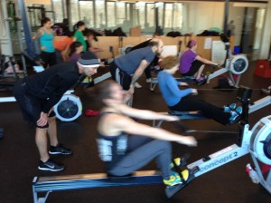 Athletes from CFH2O getting after a partner 2k at the Renegade Rowing Workshop!